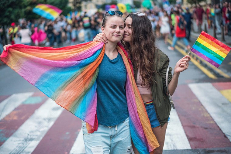 WOMEN WITH RAINBOW FLAG