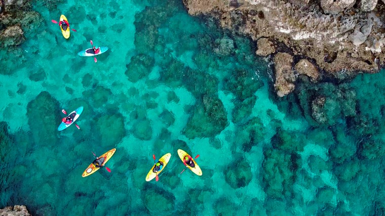 PEOPLE KAYAKING IN THE SEA OF AYIA NAPA, CYPRUS